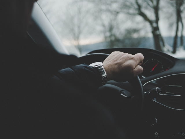 A man driving a car.